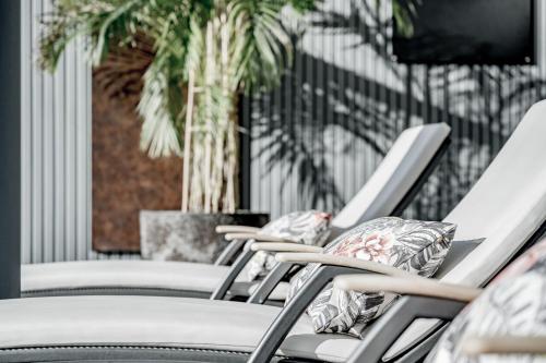a row of chairs lined up in a row at SKI - GOLF - WELLNESS Hotel Riml in Hochgurgl