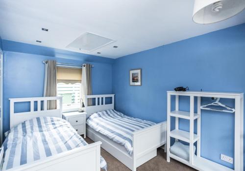 Summerside Cottage emeletes ágyai egy szobában