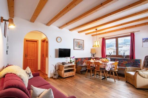 a living room with a couch and a table at Binterhof in Castelrotto