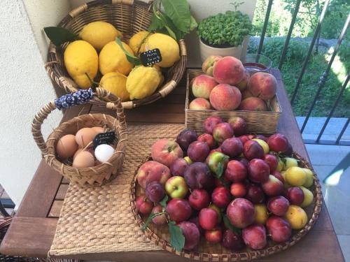 three baskets of fruits and eggs on a table at Agriturismo LaValleggia in Tovo San Giacomo