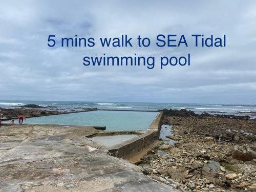 a walk to sea tidal swimming pool on the beach at Agulhasbestview in Agulhas