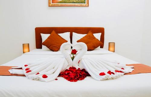 A bed or beds in a room at Bahana Guest House
