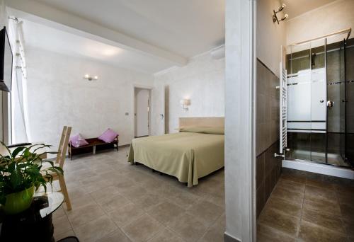 a hotel room with a bed and a table at La Finestra Sulla Reggia in Venaria Reale