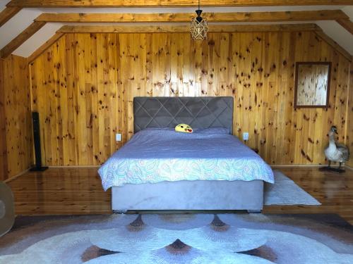 a bedroom with a bed with a stuffed animal on it at house on the hill in Cetinje