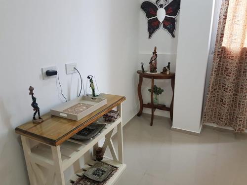 a room with a table and a clock on the wall at LAUQUEN in Trenque Lauquen