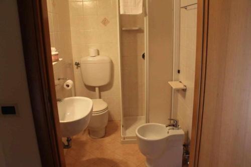 a bathroom with a sink and a toilet and a shower at Agriturismo La Fraterna in Tolle