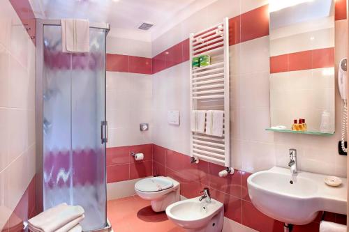 a bathroom with a sink and a toilet and a shower at Albergo Antica Corte Marchesini in Campagna Lupia