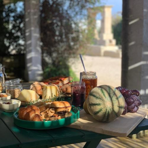 a table full of food and vegetables and a watermelon at Masseria Caposella in Ugento