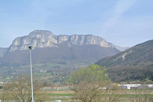 a mountain in the distance with a street light at ibis budget Chambéry Sud Challes Les Eaux in Challes-les-Eaux