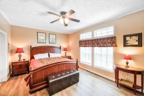a bedroom with a bed and a ceiling fan at Hillside Hideaway in McHenry
