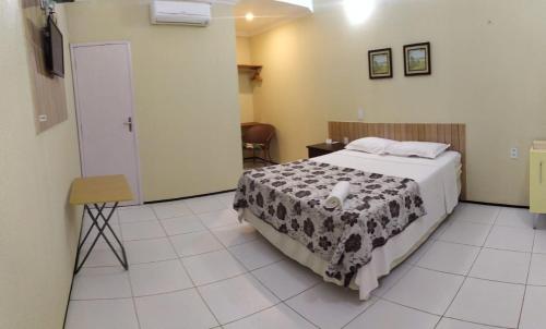 
A bed or beds in a room at Pousada Itarema Residence
