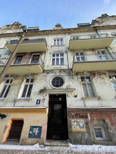 an old building with a door in front of it at DK Premium Warmińska Secesja in Olsztyn