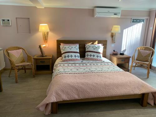 Uma cama ou camas num quarto em Villa Escandia