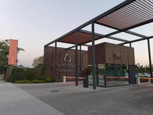 a large building with a sign in front of it at De las mejores vistas del Condominio in Nuevo Vallarta 