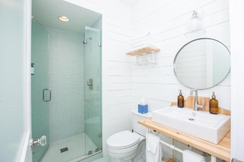a bathroom with a sink and a shower at South Main Residences by Surf Hotel in Buena Vista