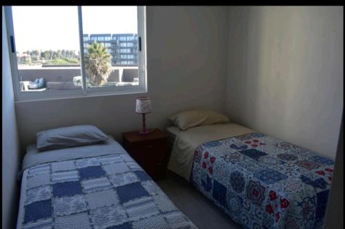 Voodi või voodid majutusasutuse Departamento avenida del mar toas