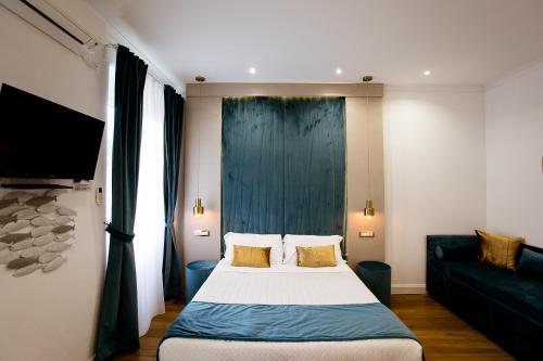 Ένα ή περισσότερα κρεβάτια σε δωμάτιο στο Apartments and Suites 5 Terre La Spezia
