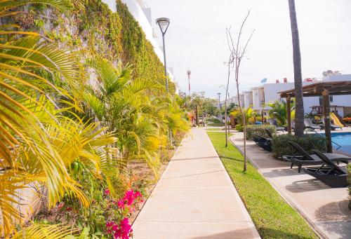 a walkway near the pool at the resort at CASA EN PRIVADA FRENTE A LA PLAYA CON ALBERCA! in Mazatlán