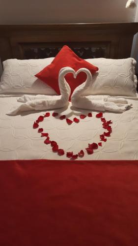 Ένα ή περισσότερα κρεβάτια σε δωμάτιο στο Aparta Hotel El Refugio de María