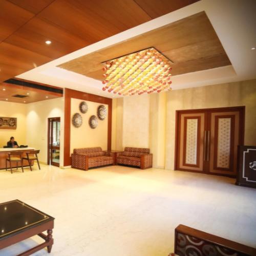 a large living room with a ping pong table at Regency Square Hotel in Gwalior