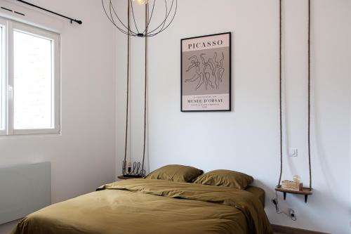 Ένα ή περισσότερα κρεβάτια σε δωμάτιο στο L’Intemporel 40