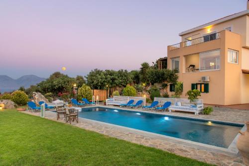 an image of a villa with a swimming pool at Villa Odyssia in Agios Nikolaos