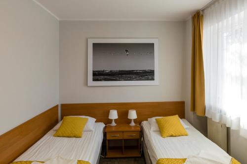 Ένα ή περισσότερα κρεβάτια σε δωμάτιο στο Hotel Sport