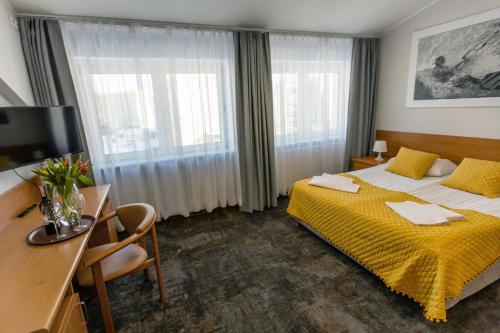 Ένα ή περισσότερα κρεβάτια σε δωμάτιο στο Hotel Sport