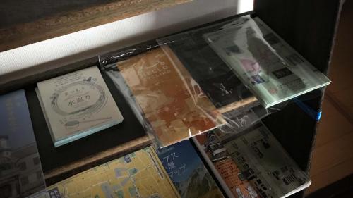 an open box with a watch in it at Hostel みんか松本 in Matsumoto