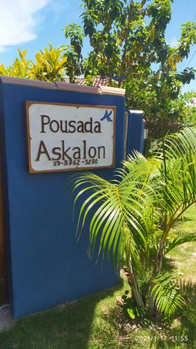a sign for a possada akalision at Pousada Askalon in Itaúnas