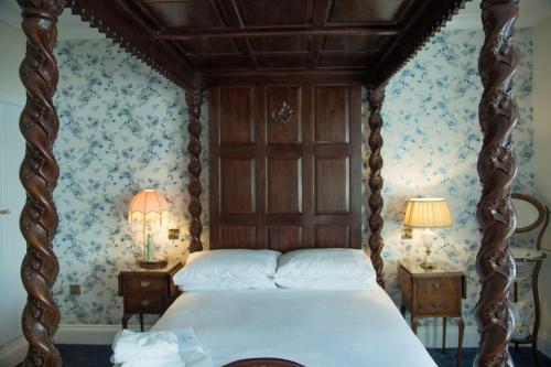 a bedroom with a bed and a dresser at The Royal in Barmouth