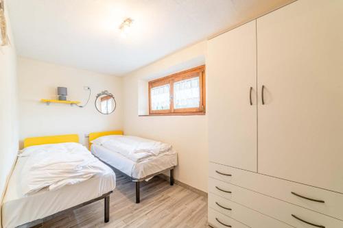 En eller flere senger på et rom på Appartamento Dei Pini