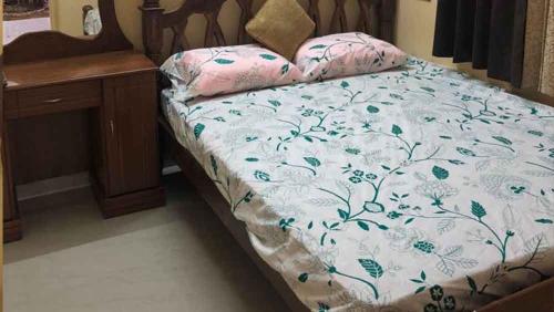 En eller flere senger på et rom på Sri Ram Guest House - Mayiladuthurai
