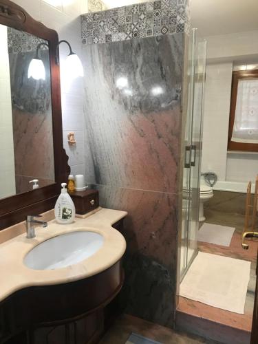 a bathroom with a sink and a shower at La Vie en Rose Mattinata in Mattinata