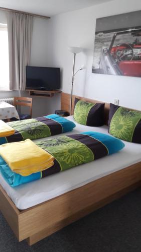 a pair of beds in a hotel room at Ferienwohnung "beim Hirsch" Bregenzerwald in Langenegg