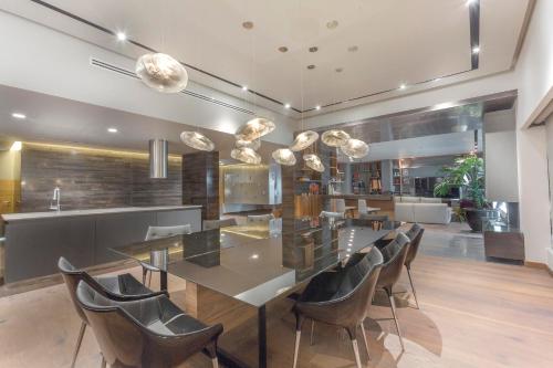 a dining room with a table and chairs at Presidente InterContinental Mexico City by IHG in Mexico City