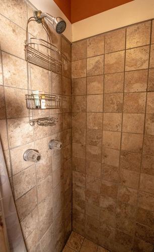 a bathroom with a shower with a glass door at Casablanca Inn on the Bay in Saint Augustine