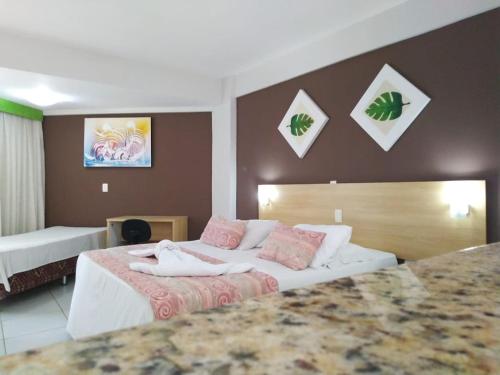 a hotel room with two beds at Marsallis Praia Mar in Natal