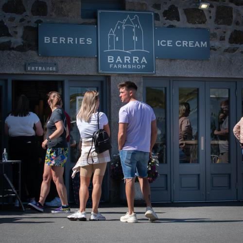 a group of people standing in front of a store at The Lodges @ Barra Castle in Inverurie