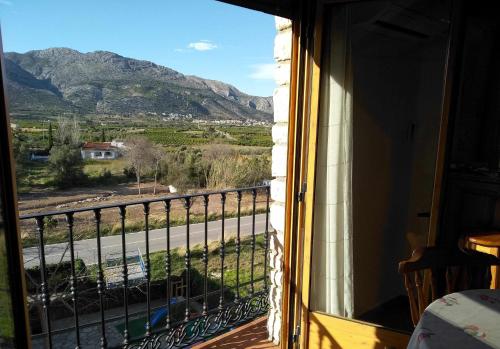 a window with a view of a mountain at La Casa del Carrebaix in Orba