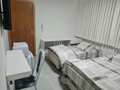 Postel nebo postele na pokoji v ubytování Hotel Avelar