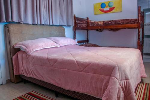 En eller flere senger på et rom på Casa Rebello - Pousada