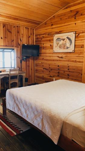 Postel nebo postele na pokoji v ubytování Chama Trails Motel