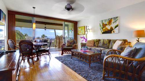 a living room with a couch and a table at Maui Eldorado - D206 in Lahaina