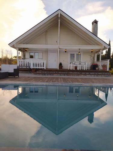a house with a pool of water in front of it at Quinta de Argos in Cehegín