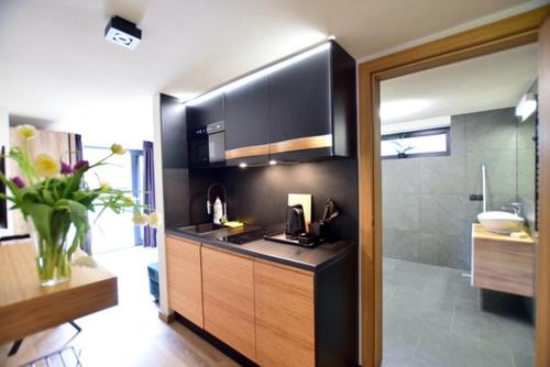 a kitchen with a sink and a counter top at Apartamenty Minimal House in Szczyrk