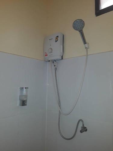 a shower in a bathroom with a blow dryer at Boonya Resort Koh Chang in Ko Chang