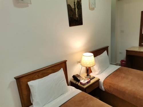 Postel nebo postele na pokoji v ubytování City Center Hotel Beni Suef