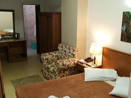 Кровать или кровати в номере City Center Hotel Beni Suef