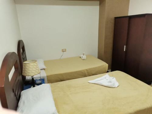 Postel nebo postele na pokoji v ubytování City Center Hotel Beni Suef